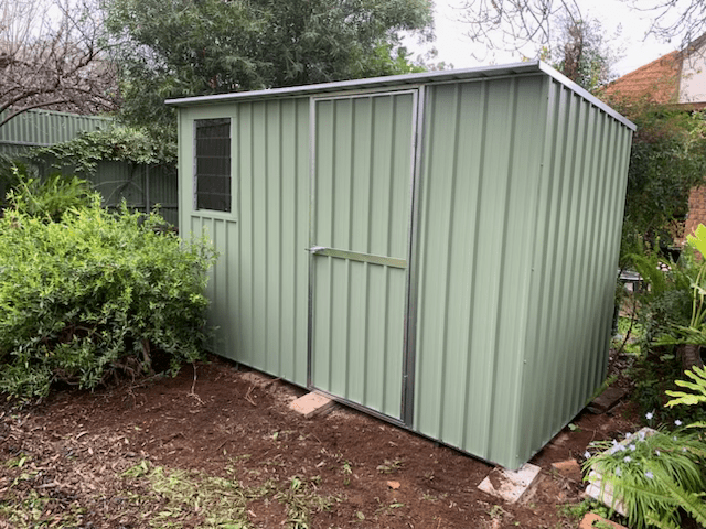 Image of a green skillion roof shed